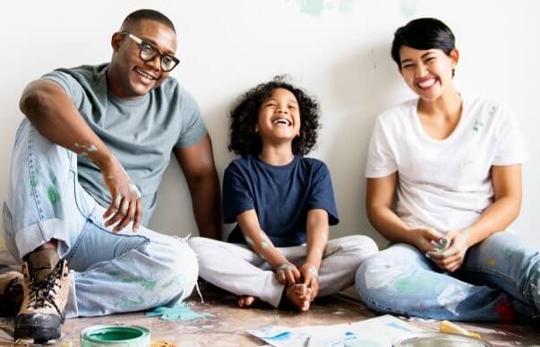 People smiling for their umbrella insurance coverage