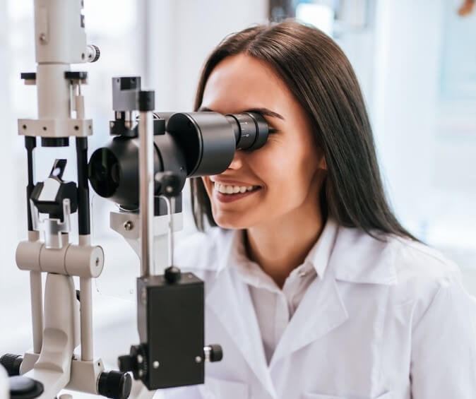 Women doing eye health tips by an eye exam