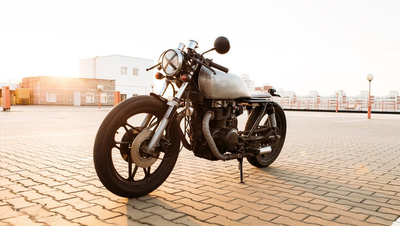 motorcycle on parking lot with anti theft so it doesn't get stolen
