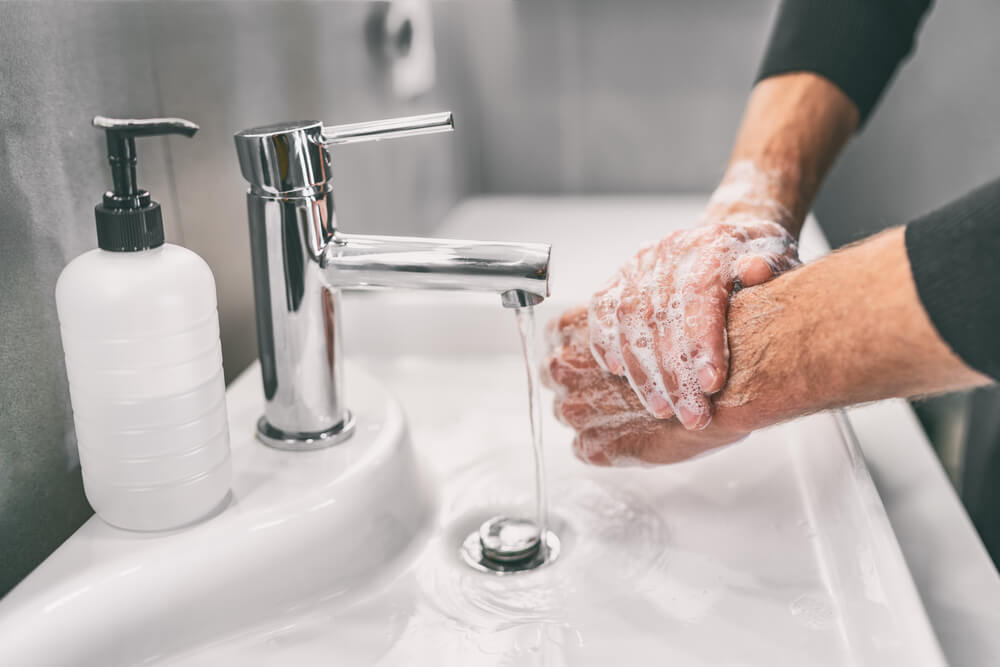 man washing hands to prevent coronavirus