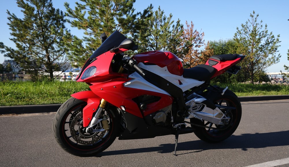 custom streetfighter motorcyle parked on a road with insurance