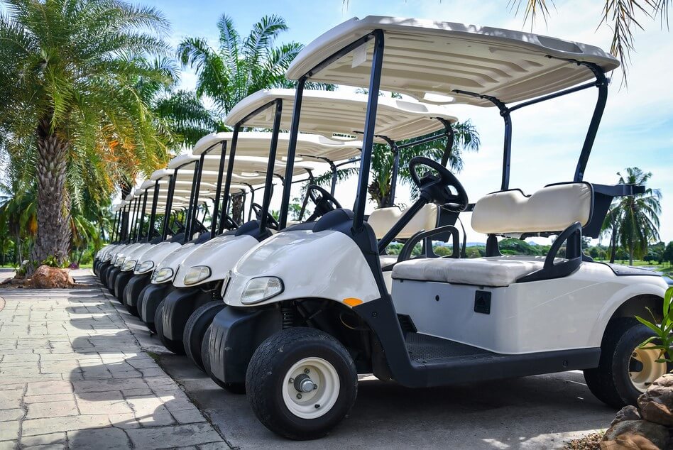 row of golf carts with insurance