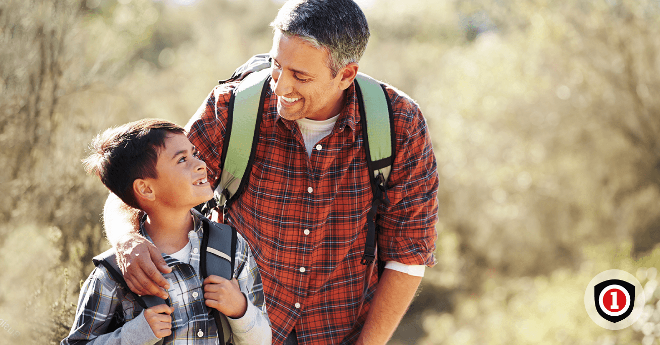 Father spending time hiking with his child 