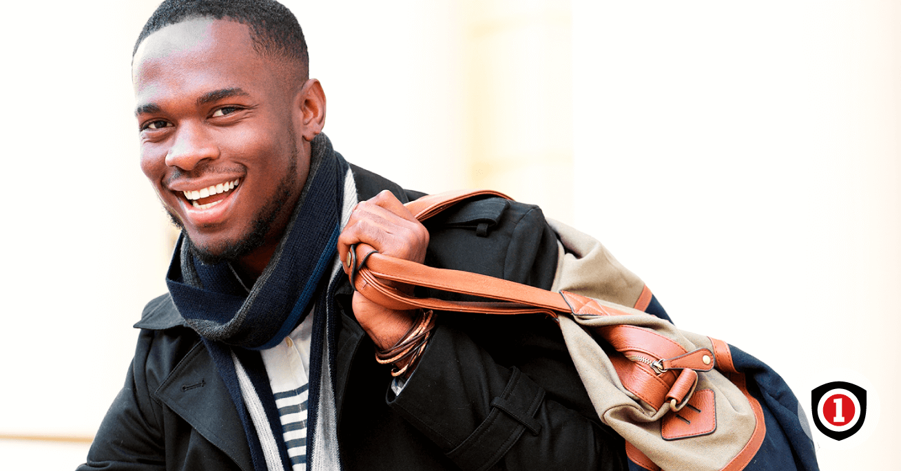 An african american single holding a bag