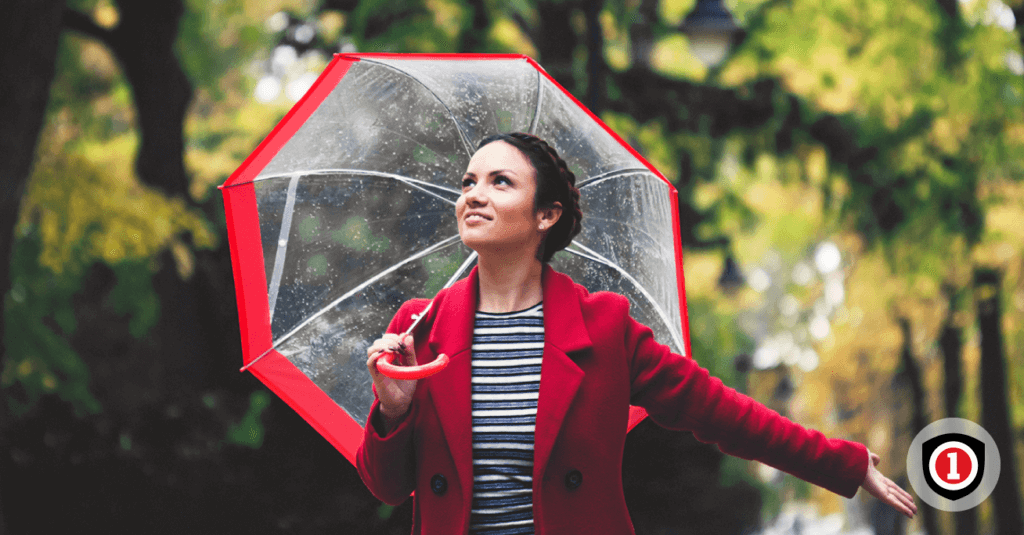 A woman holding an umbrella in the rain