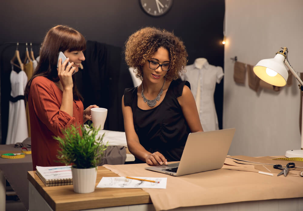 Two young entrepreneur women with employee benefits working