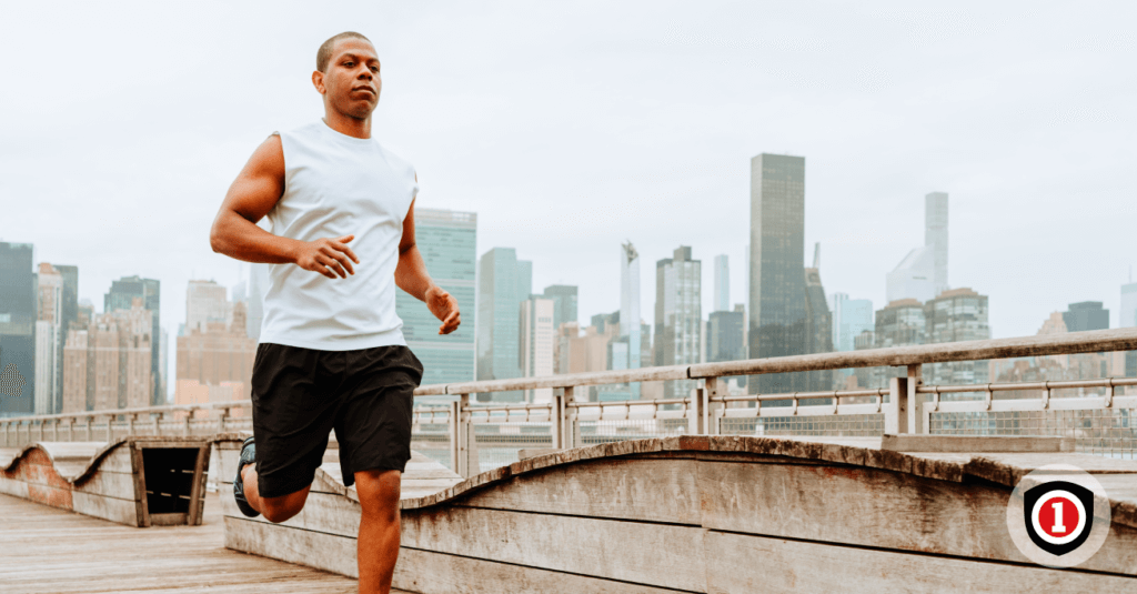 An African American running on the top of the bridge while enjoying a life insurance plan