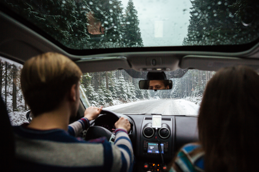 man driving car in winter weather