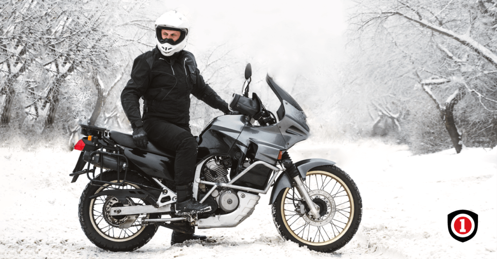 A man Riding A Motorcycle In Winter