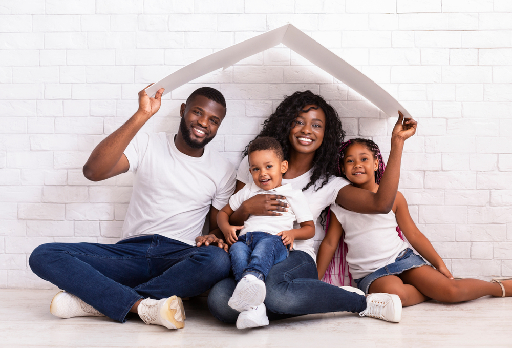 african american family with protection over their head to signify homeowners insurance
