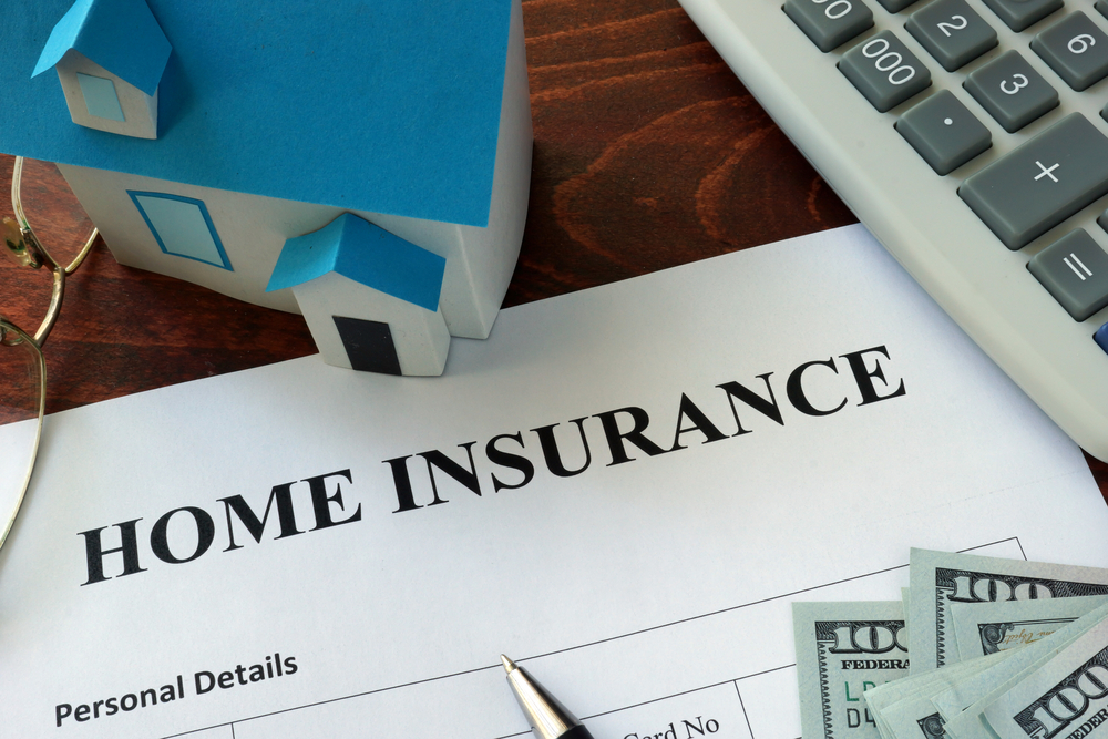 Home,Insurance,Form,And,Dollars,On,The,Table. homeowners insurance policy paperwork