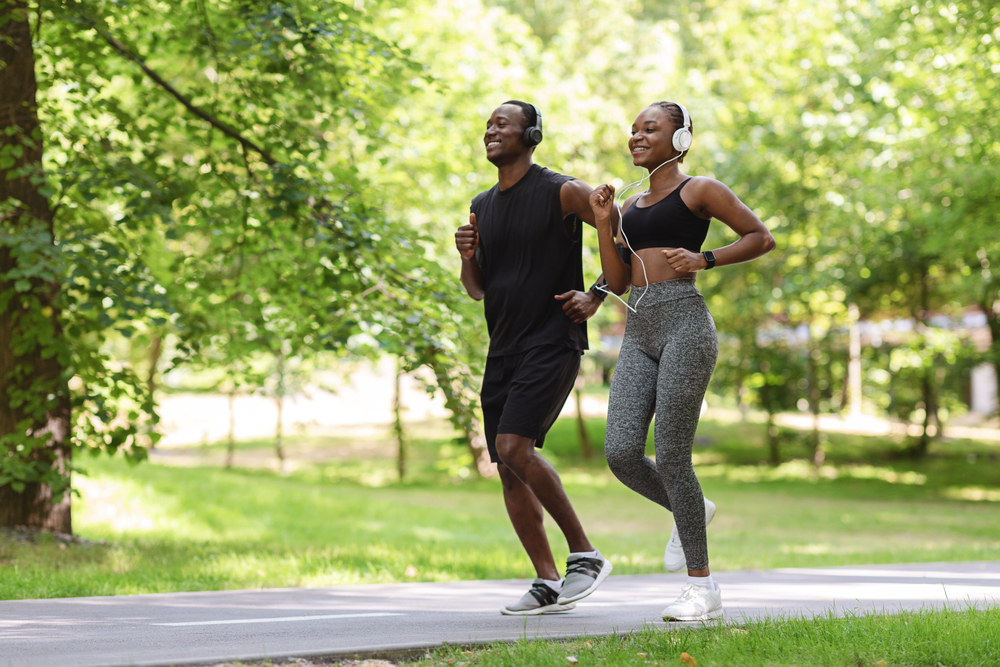 young couple running outside