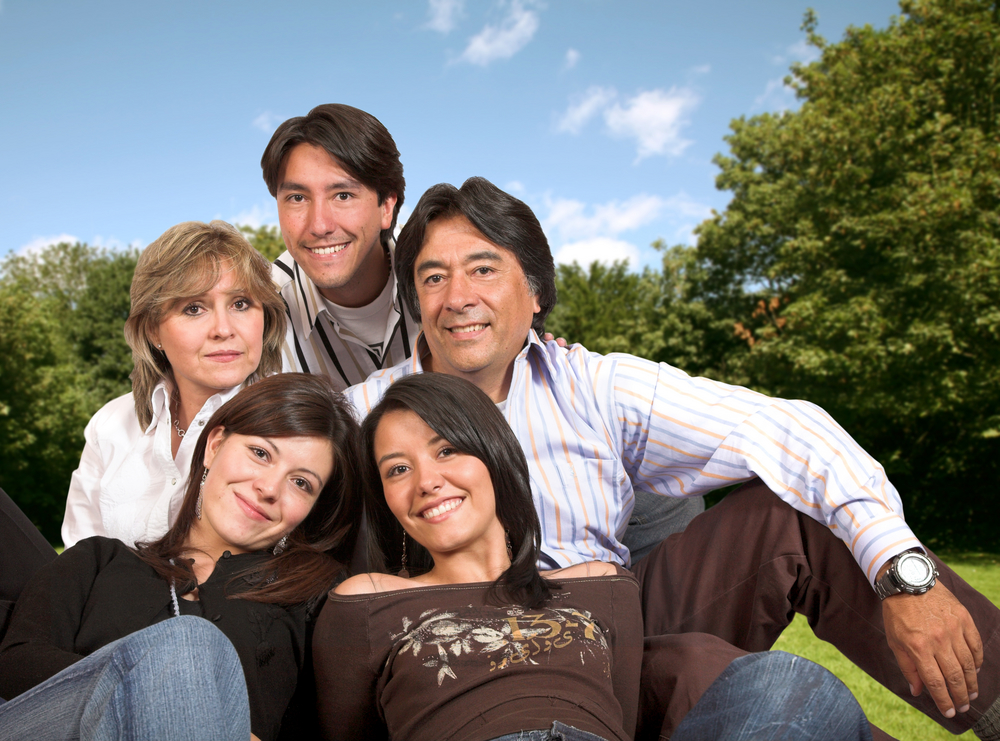 Beautiful,Family,Outdoors,In,A,Park Young beautiful family in the park