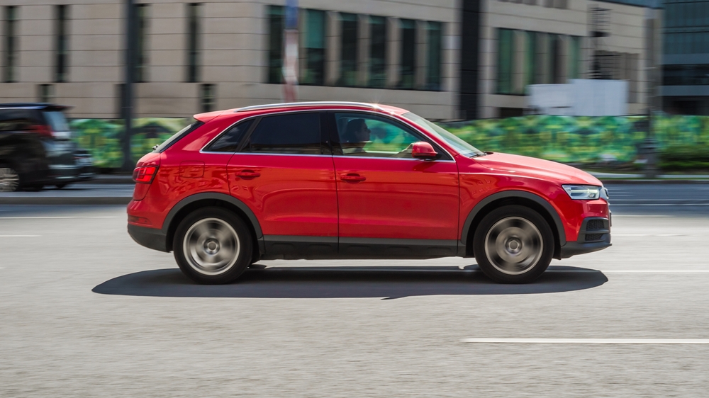 Moscow,,Russia,-,August,2021:,Red,Audi,Q3,Is,Driving red suv