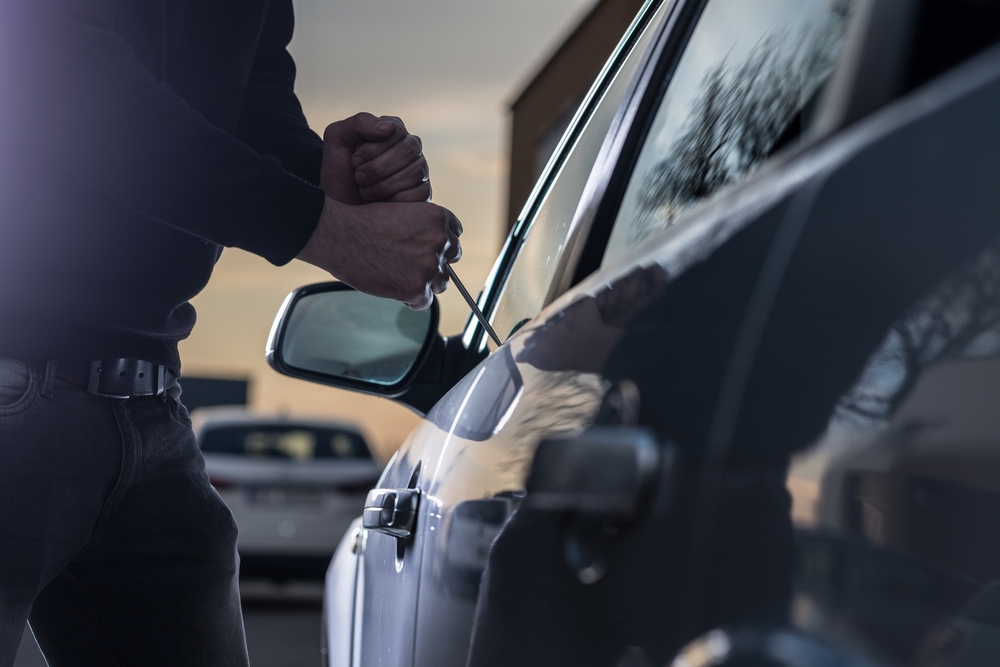 thief breaking into car