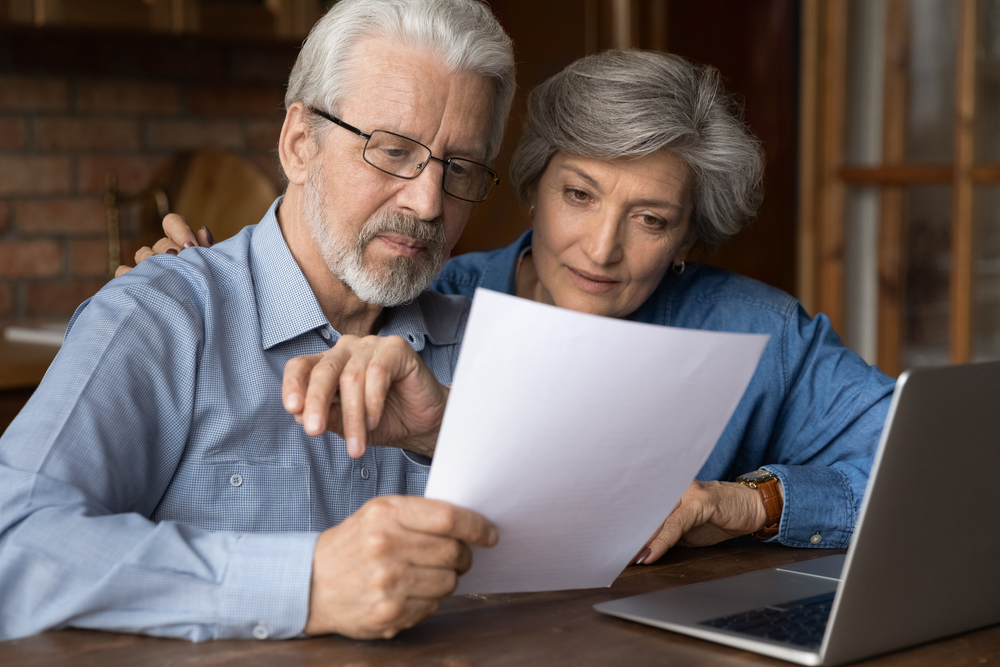 older couple looking over life insurance policy