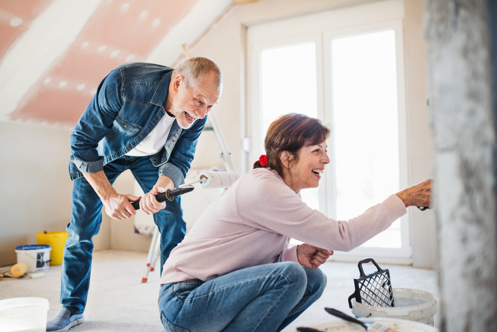 Mature couple renovates a room in their home