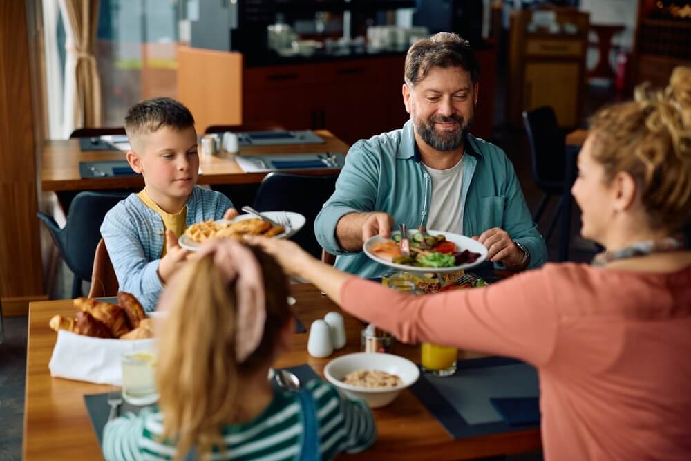 Family eats at restaurant while their home is repaired - best homeowners insurance.
