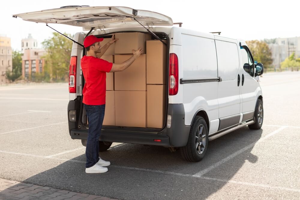 ion-what-does-commerical-auto-insurance-cover-and-why-do-you-need-it-1 Employee loads up delivery van - best commercial auto insurance.