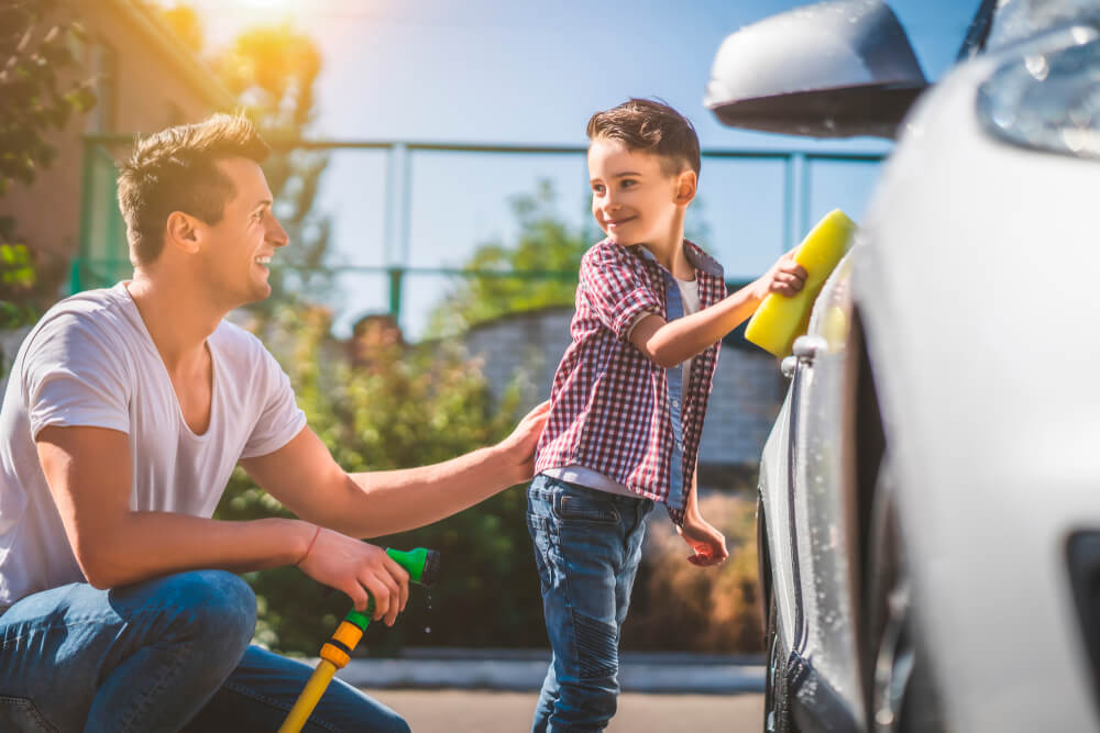 ino-how-to-determine-the-right-amount-of-car-insurance-for-you-1 Father and son wash the car, making sure he has the right amount of insurance.