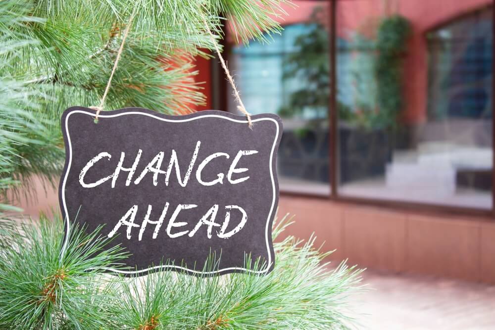 Change ahead symbol, switch home insurance providers. Chalk blackboard with words Change Ahead.