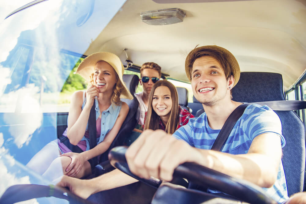 Beautiful young people on a road trip on a summers day.