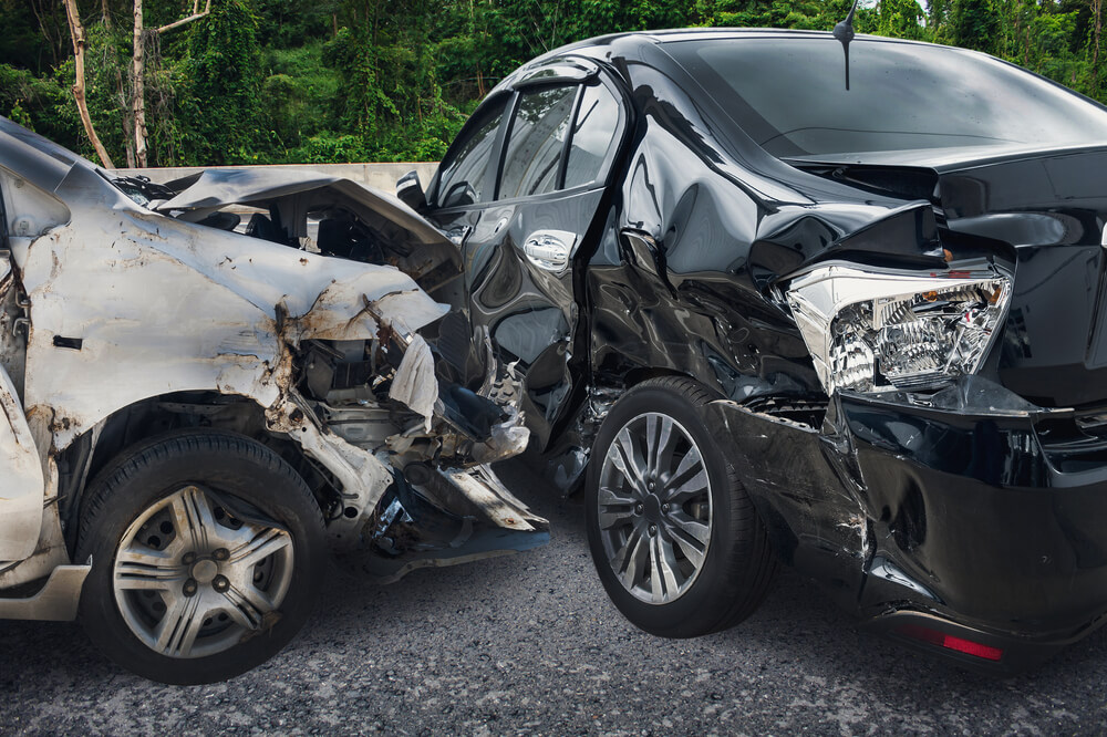 Severely damaged cars after a crash illustrating diminished value after a car accident.