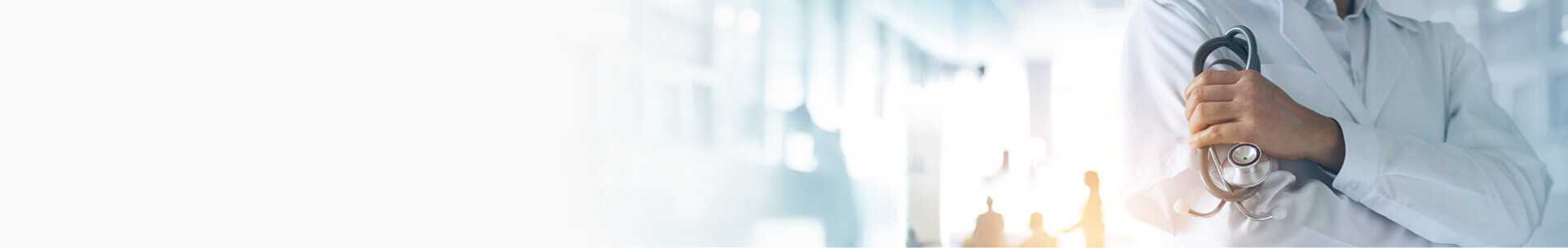 Doctor with arms crossed holding a stethoscope