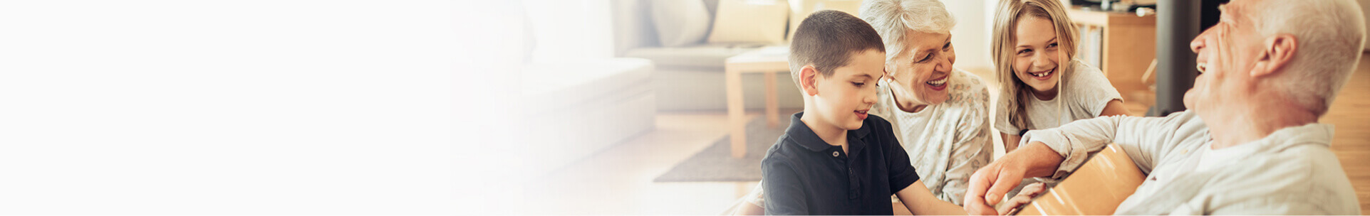 Happy grandparents with two smiling grandchildren