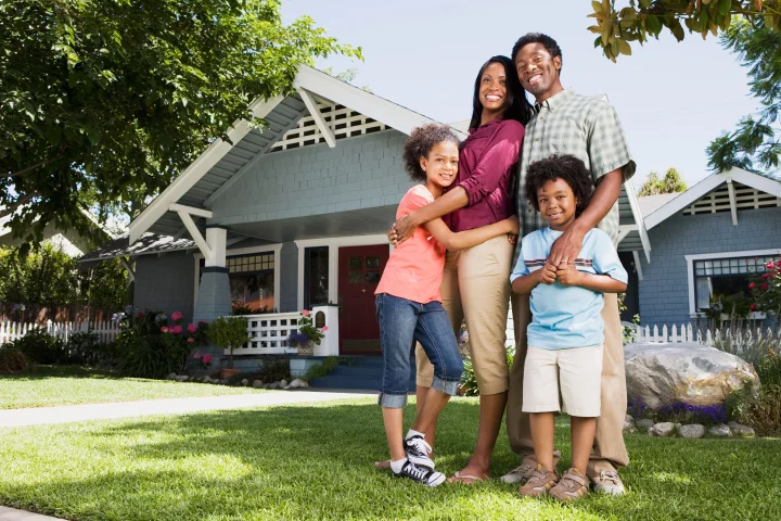 Family in front of their own home