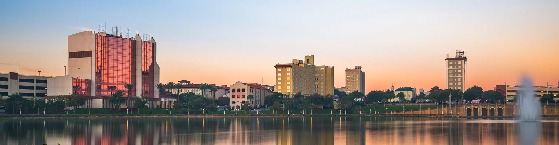 Lakeland, Florida, USA downtown cityscape on the lake at dawn.