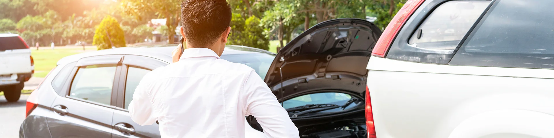 Businessman using smart phone and call the car insurance After traffic Accident.