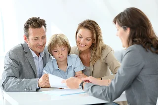 Family meeting insurance agent to buy a liability car insurance policy.