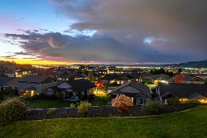 Sunset evening view over Spokane and Spokane Valley from a hilltop in Liberty Lake - best home insurance in Washington.