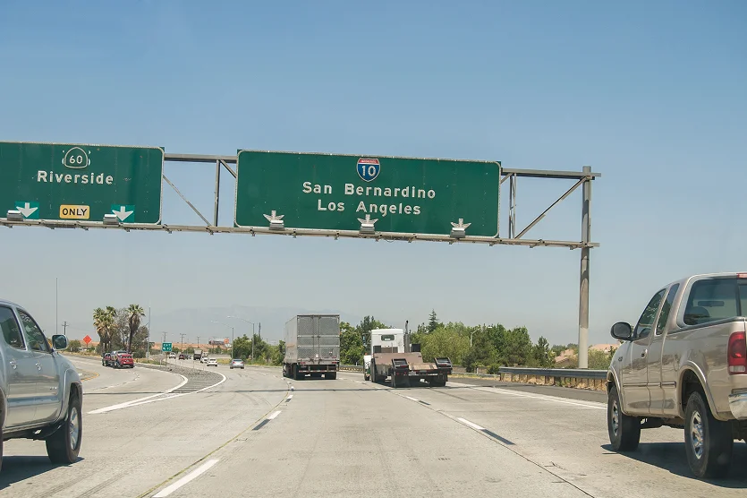 Highway traffic towards San Bernardino and Los Angeles with exit to Riverside. California, United States.