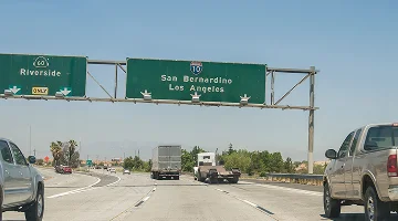 Highway traffic towards San Bernardino and Los Angeles with exit to Riverside. California, United States.