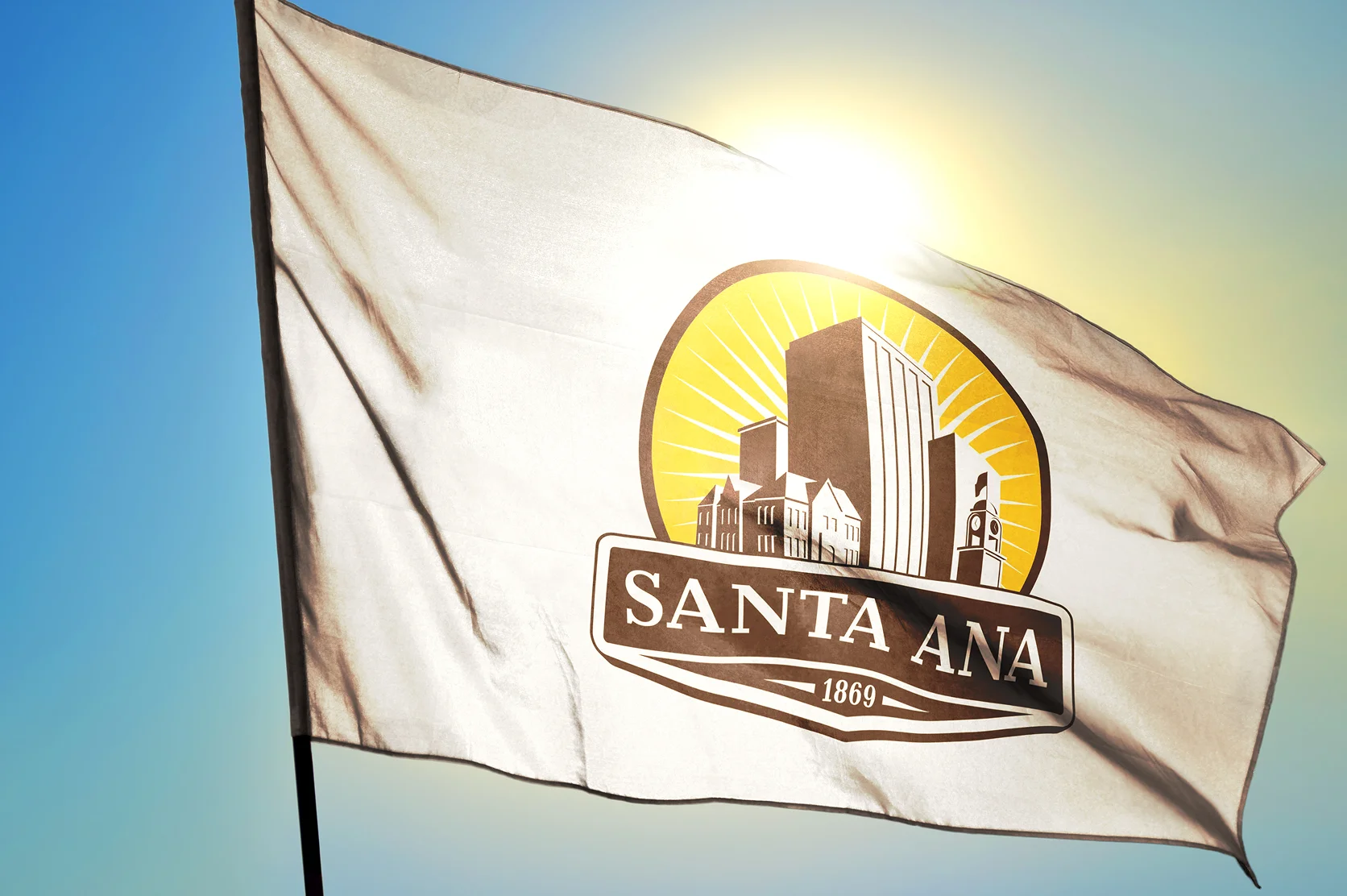 Santa Ana of California of United States flag waving on the wind in front of sun - High-quality insurance in California.