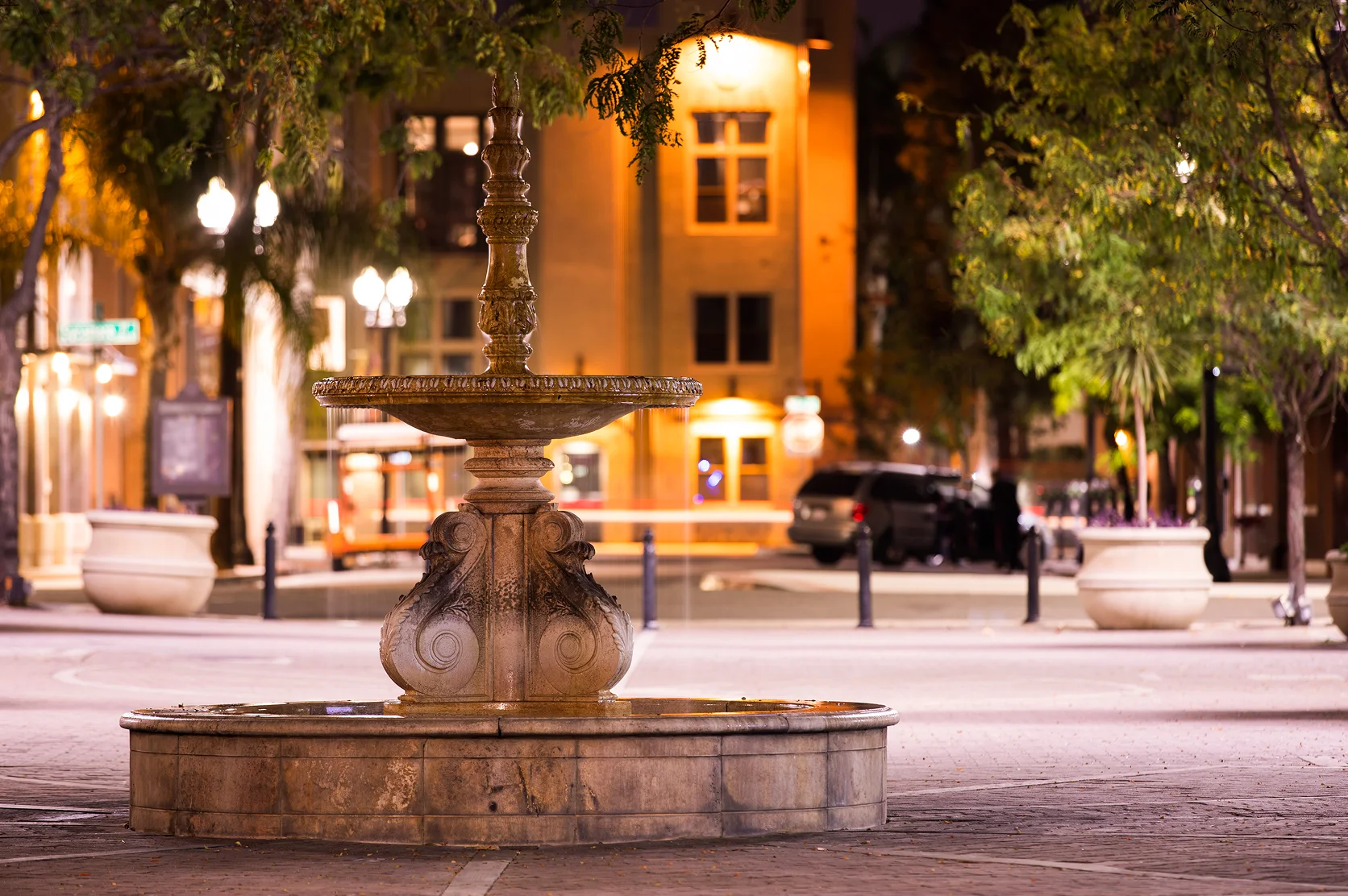 Night time view of a historic public fountain in downtown Santa Ana - best car insurance in California.
