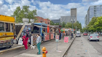 A variety of food trucks in downtown Portland - best homeowners insurance in Oregon.