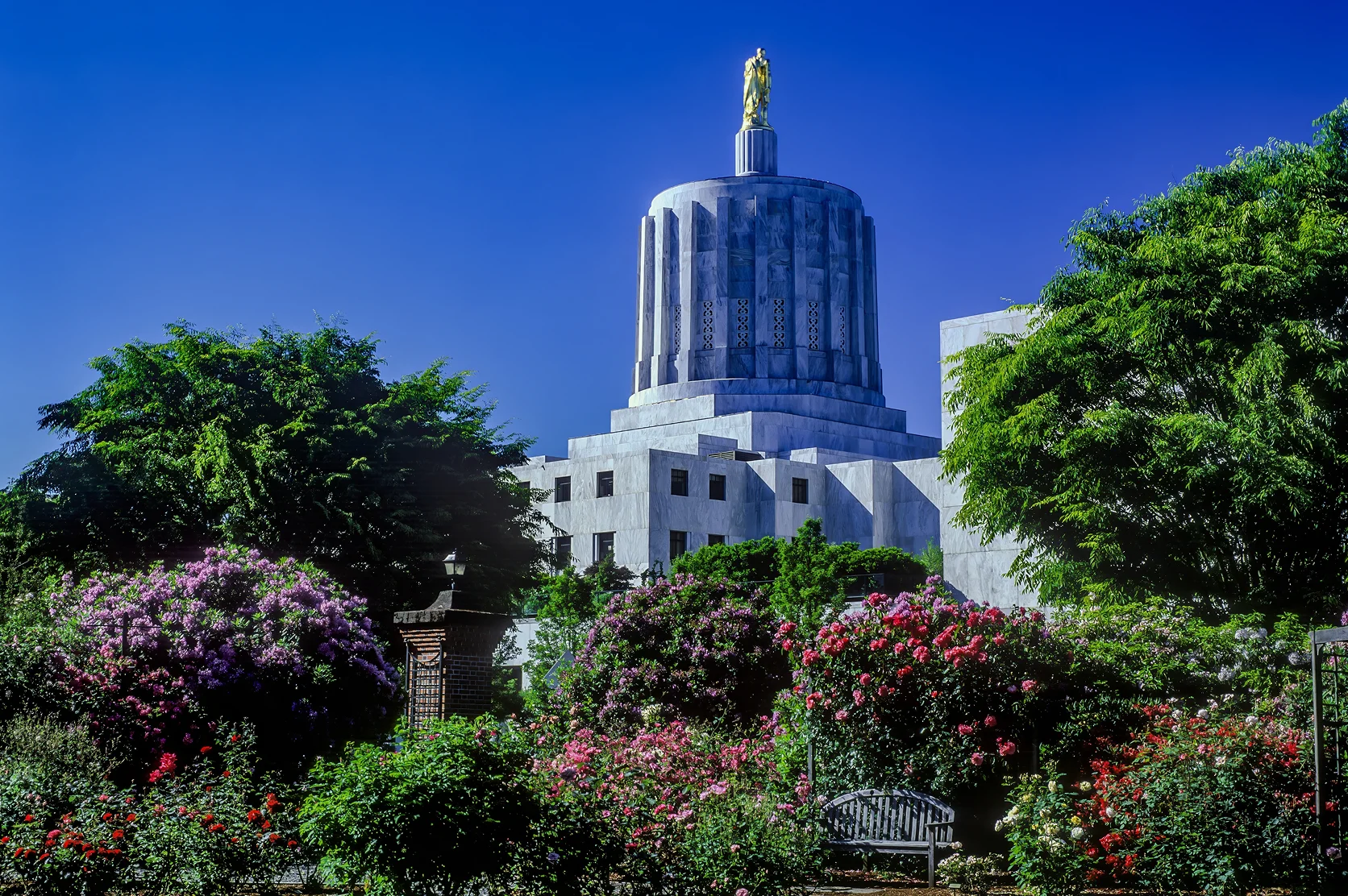 A flowering garden surrounds the Oregon State capitol building, Salem