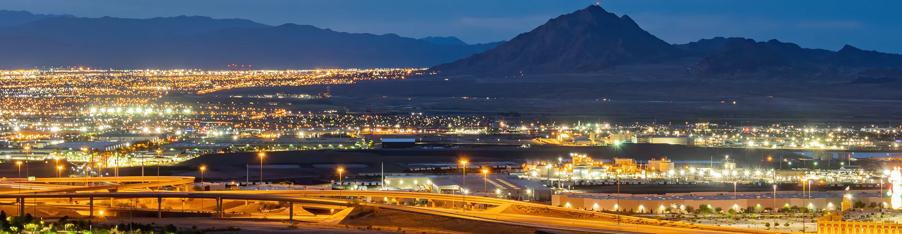 Dusk high angle view of the Frenchman Mountain and cityscape from Henderson View Pass at Nevada.