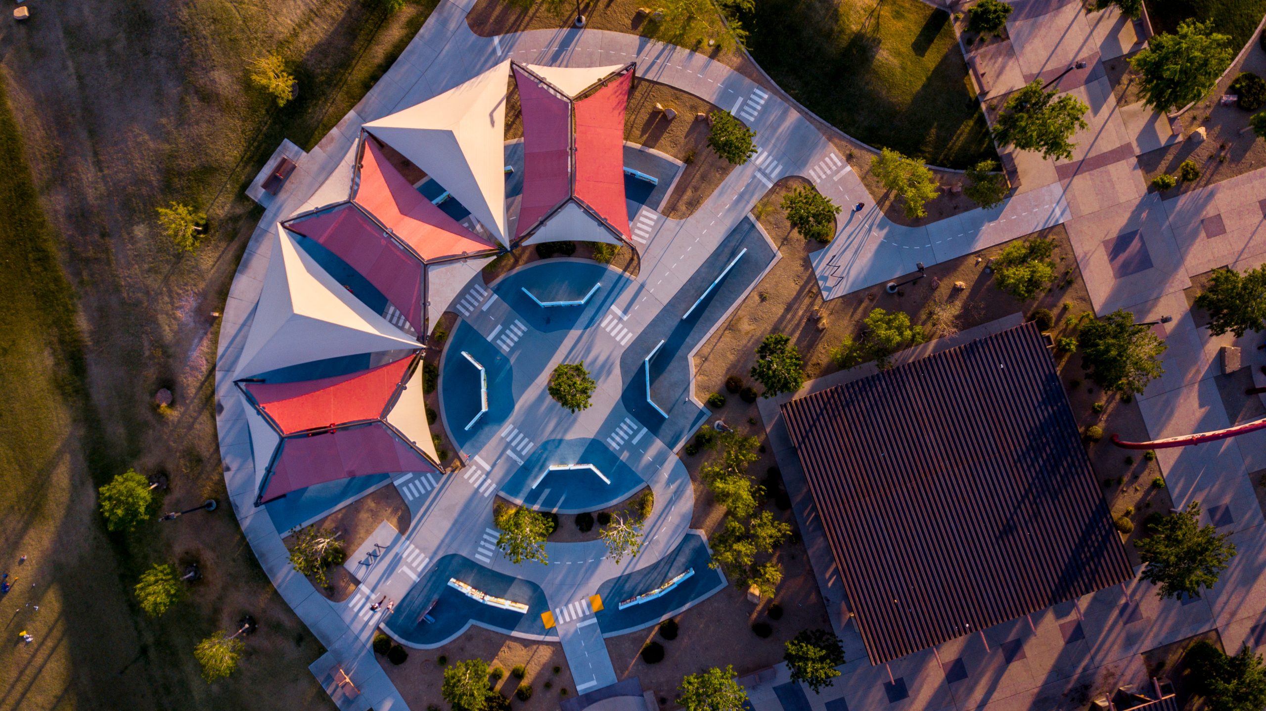 An aerial view of a shade structure and surrounding amenities at Mountains Edge Regional Park in Enterprise, Nevada.