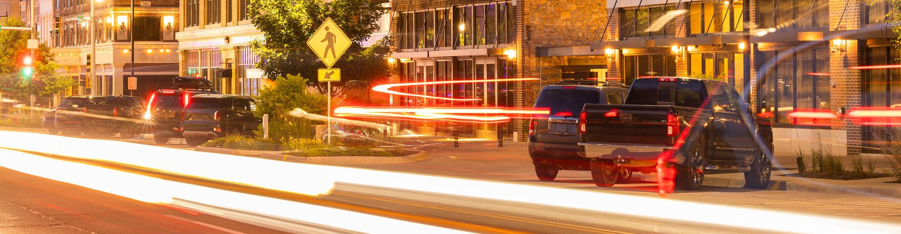 Evening traffic streams down Kansas Ave in the heart of historic downtown Topeka.