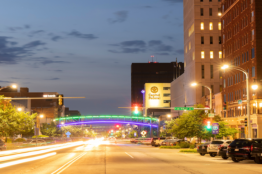 Evening traffic streams down Kansas Ave in the heart of historic downtown Topeka.
