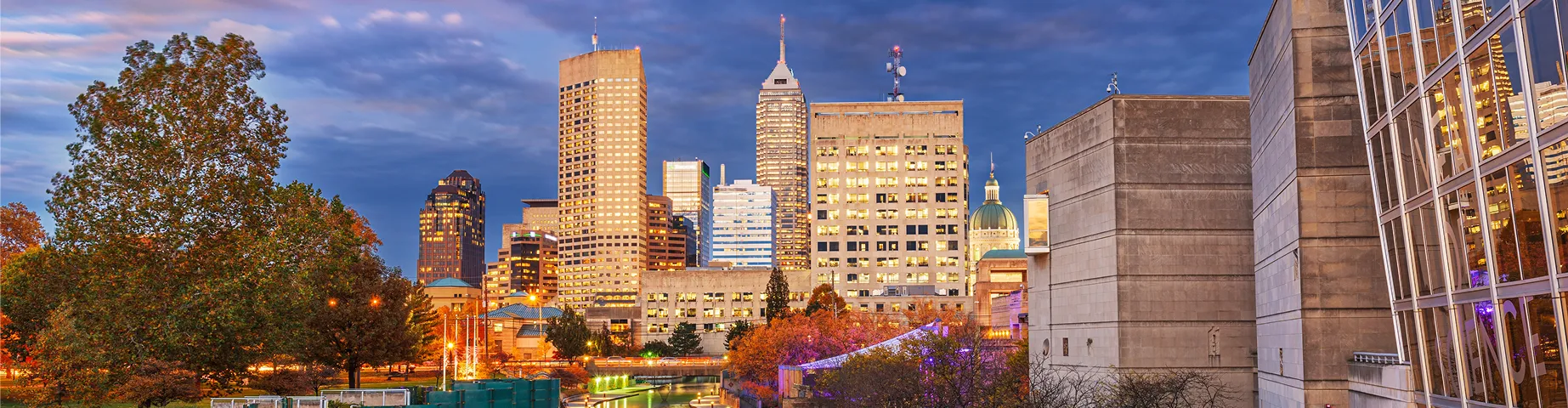 Indianapolis, Indiana, USA downtown cityscape over the river walk at twilight