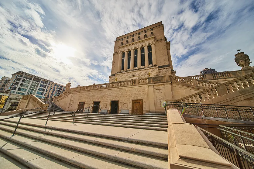 Grand Neoclassical Building with Stone Steps and Dynamic Sky, Indianapolis