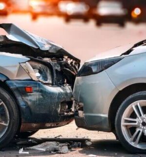 Two damaged vehicles after a collision involving an uninsured driver, illustrating what happens when an uninsured driver hits you.
